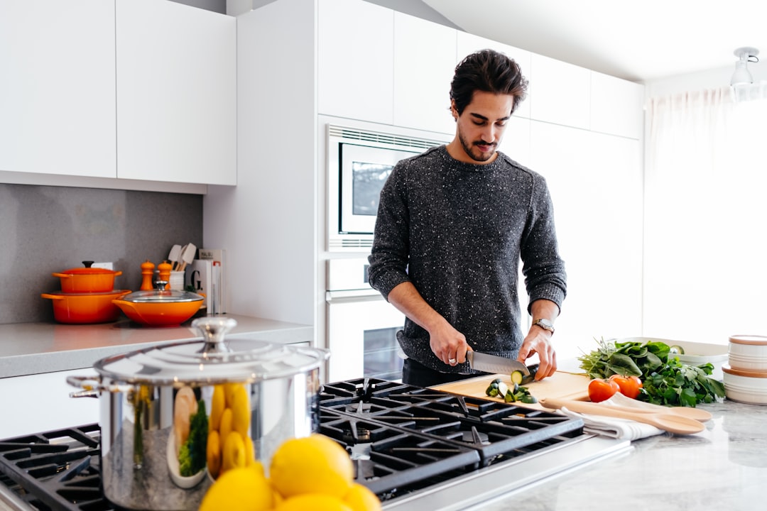 how to meal prep for the week with containers of rice, vegetables, and chicken on a clean kitchen counter